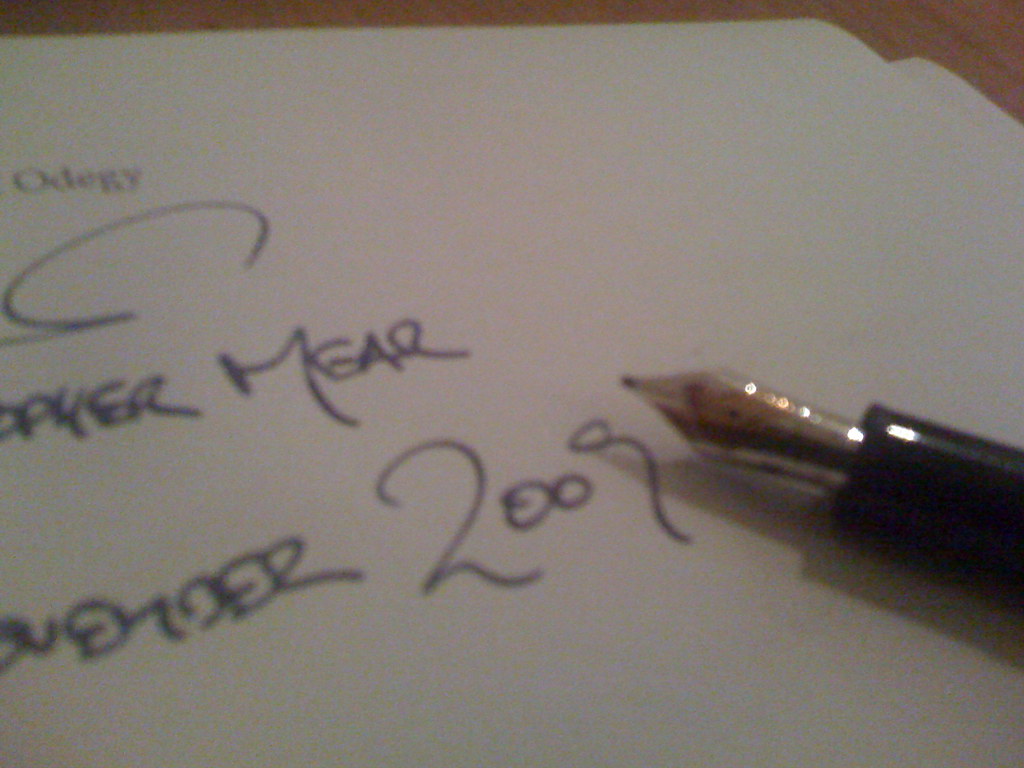 Contract being signed with a pen